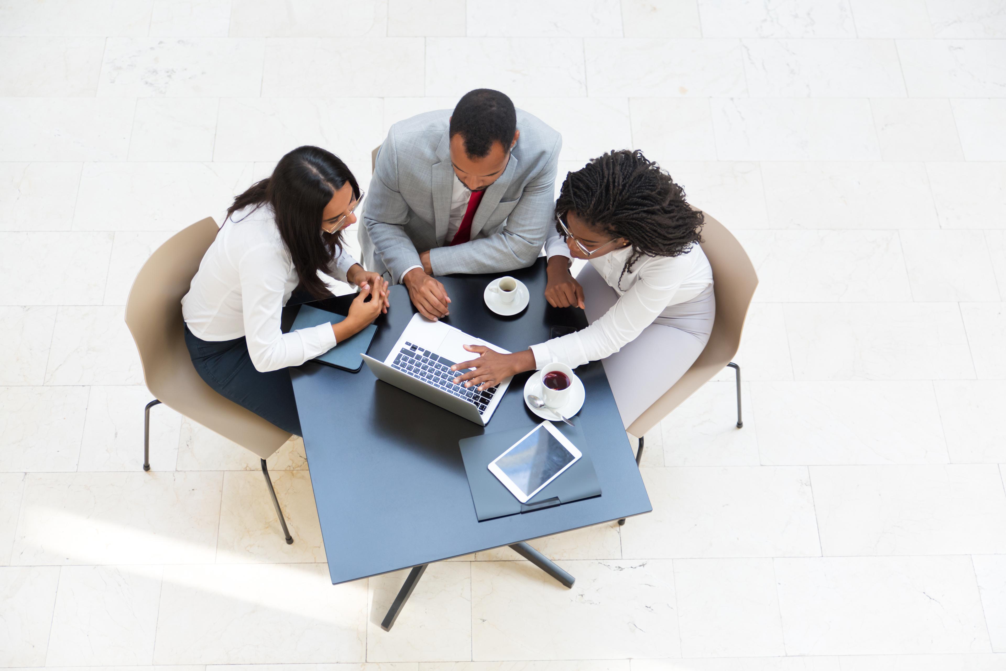 Team collaborating around a table in a bright office